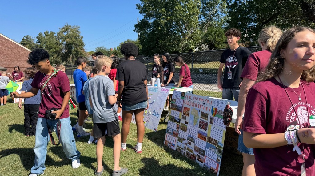 student learning from high schooler