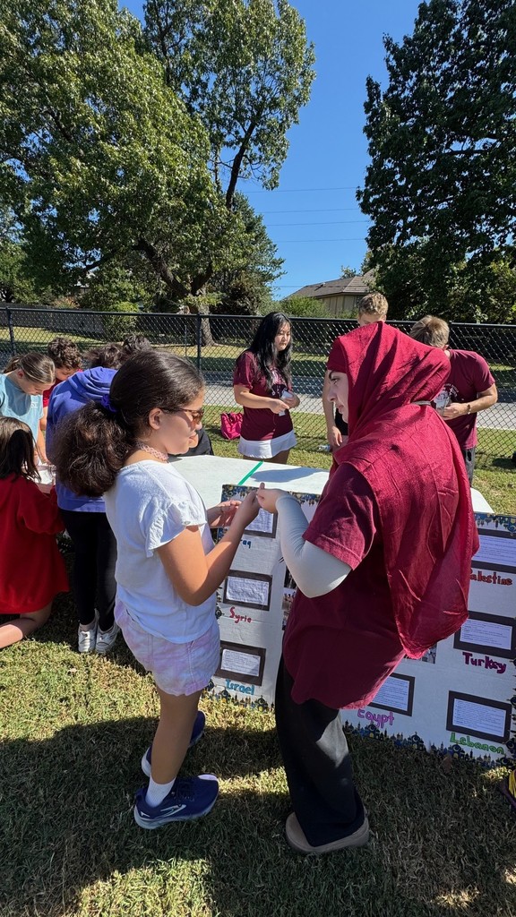 student learning from a high school student