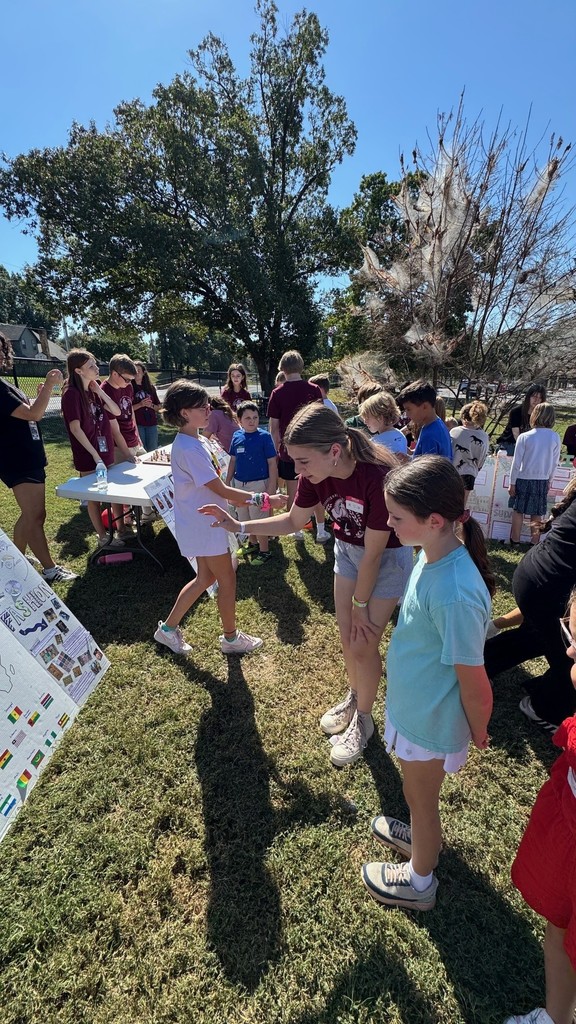 student learning from high schooler