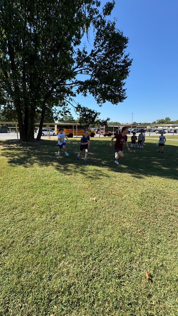 students running with high schooler