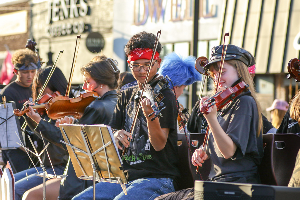 float showing students playing orchestra insturments
