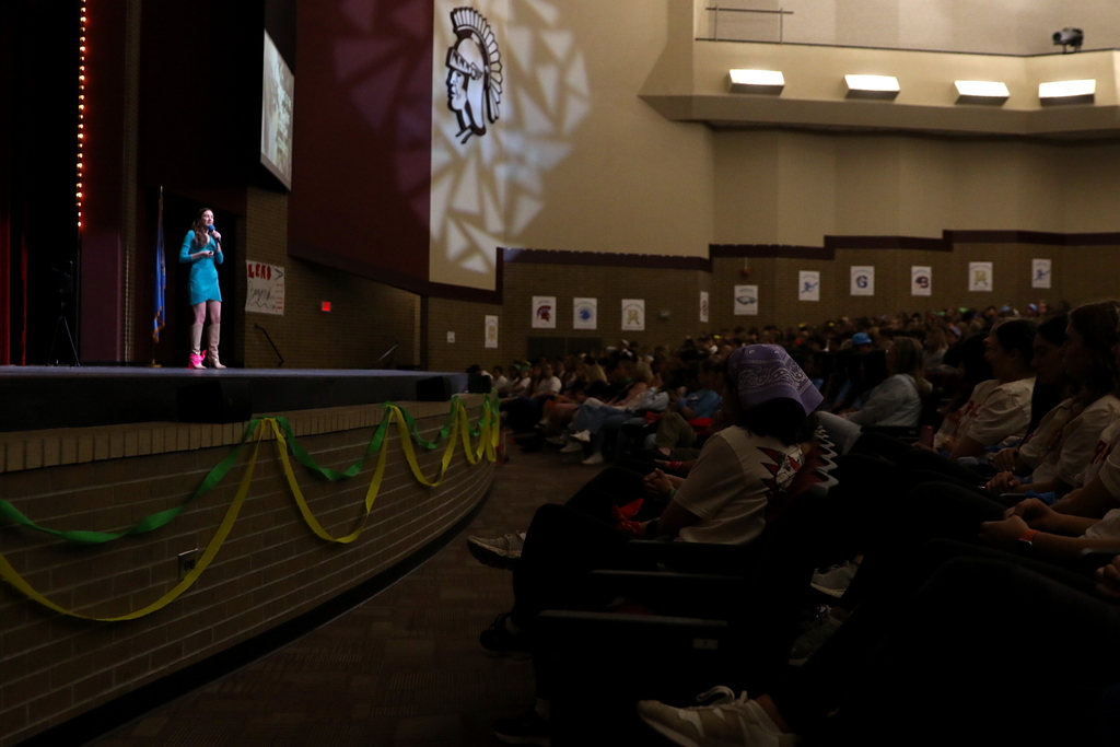 side view of stage at Performing Arts Center with students listening to Lauren Frost, former Miss Oklahoma