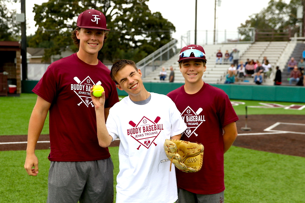 Buddy baseball player posing with baseball players