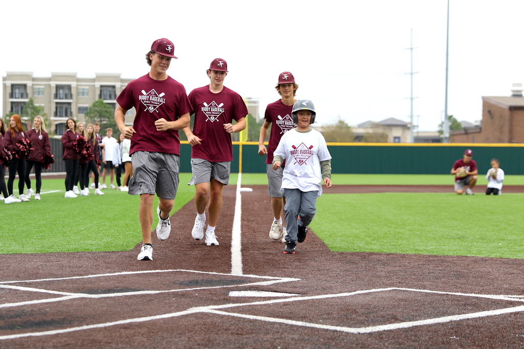 boy buddy baseball player running toward home plate