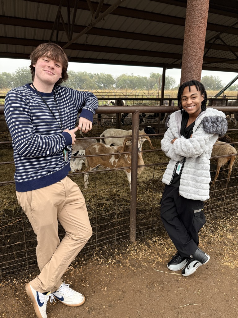 two students with goats