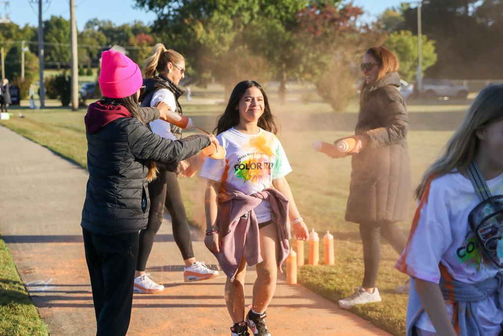 girl running through color in the air
