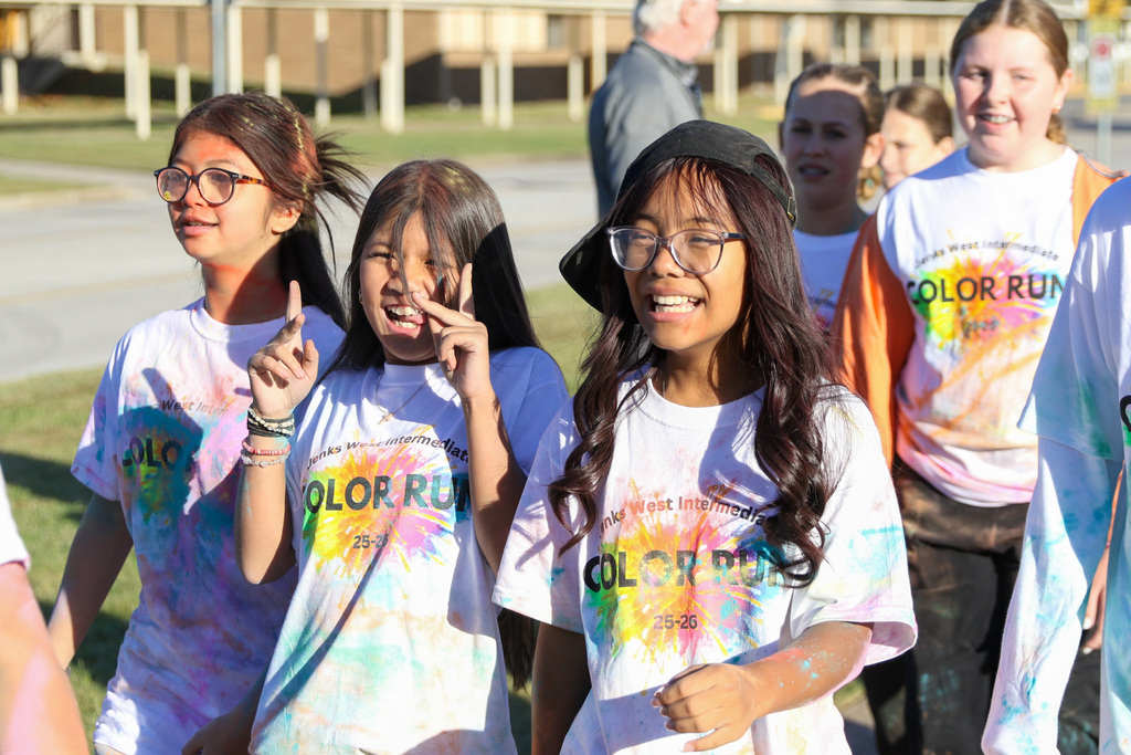 girls smiling and laughing walking