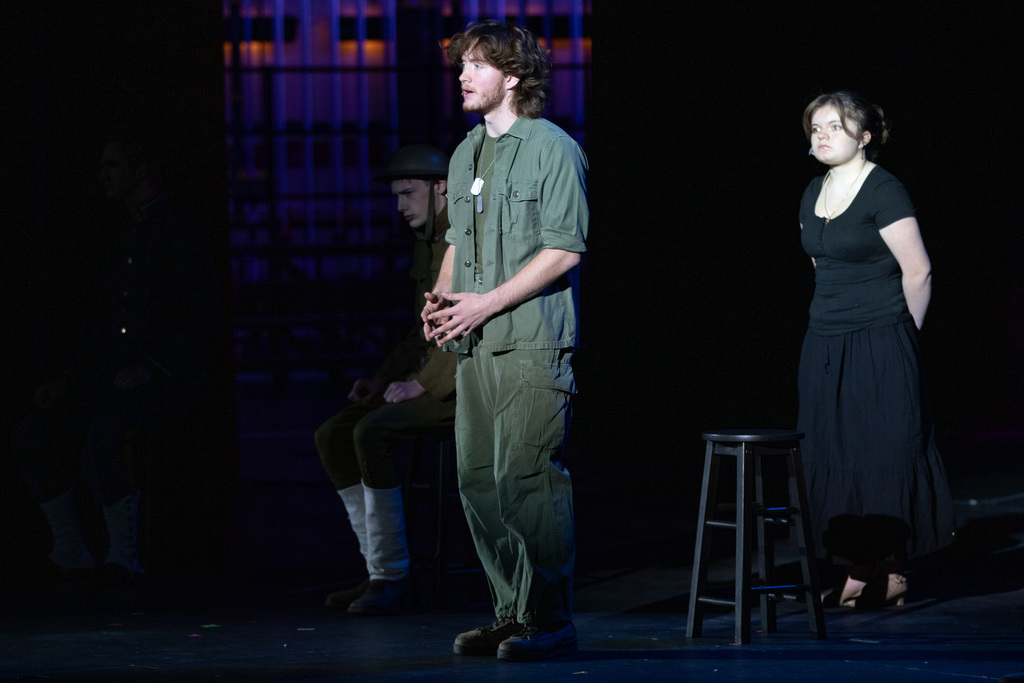 student acting as a vietnam veteran reciting letters from wr