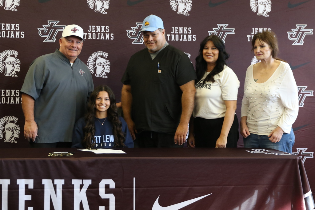 photo of Isabella Rodman with family and coach