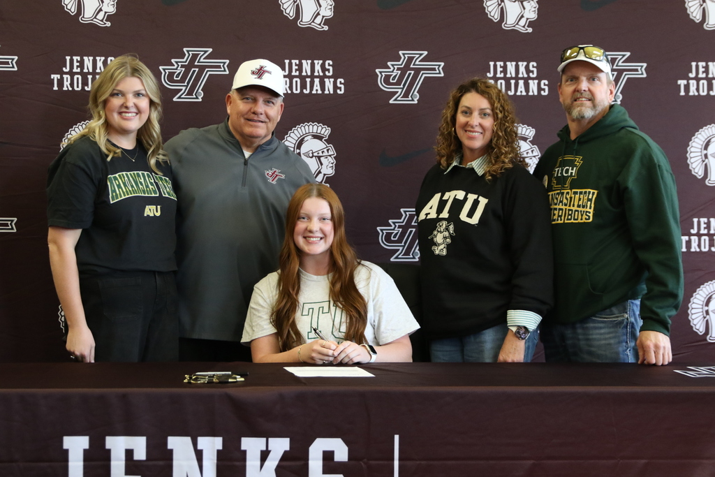 photo of Josie Jervis with coach and family