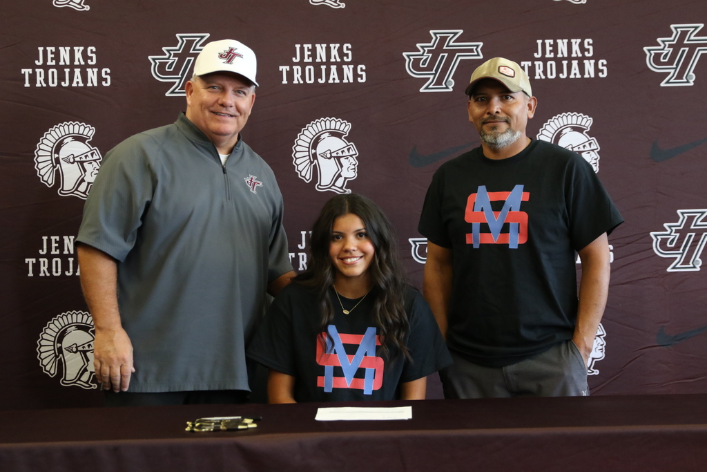 photo of Brylie Blossom with family and coach