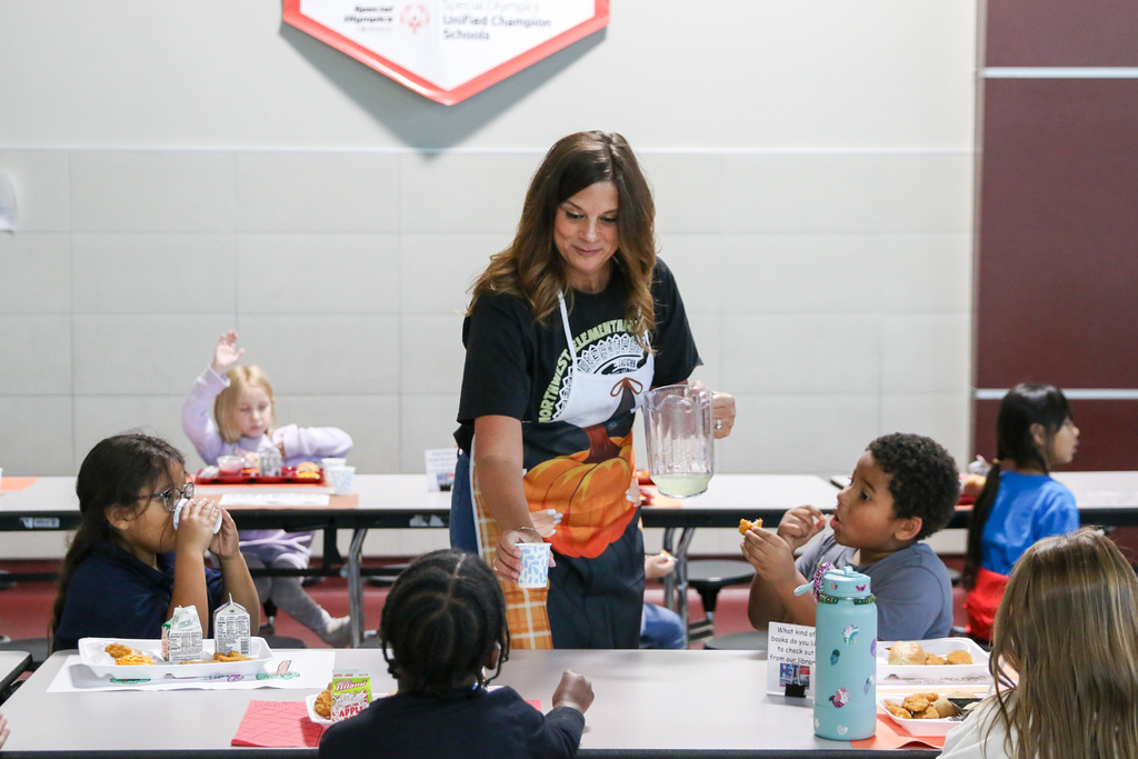 teacher serving a student lemonade