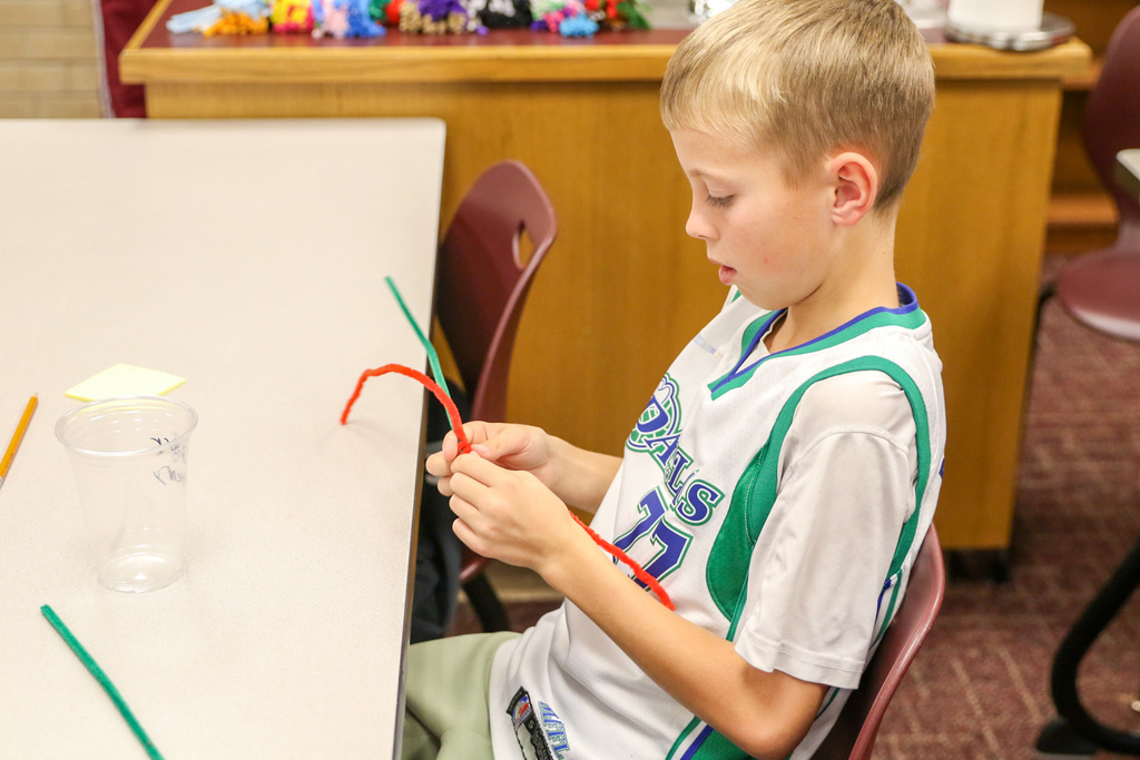student twisting pipe cleaners