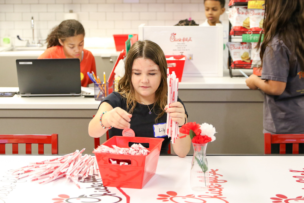 student counting straws at chick fil a