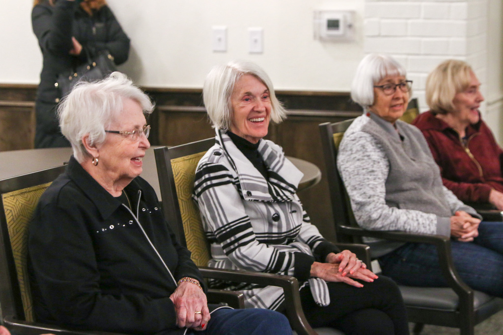 residents smiling and enjoying the christmas carols