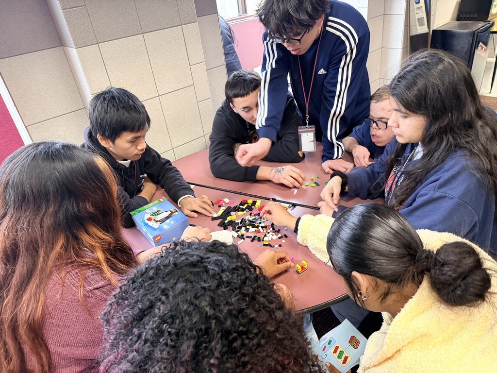 Students looking at Legos 