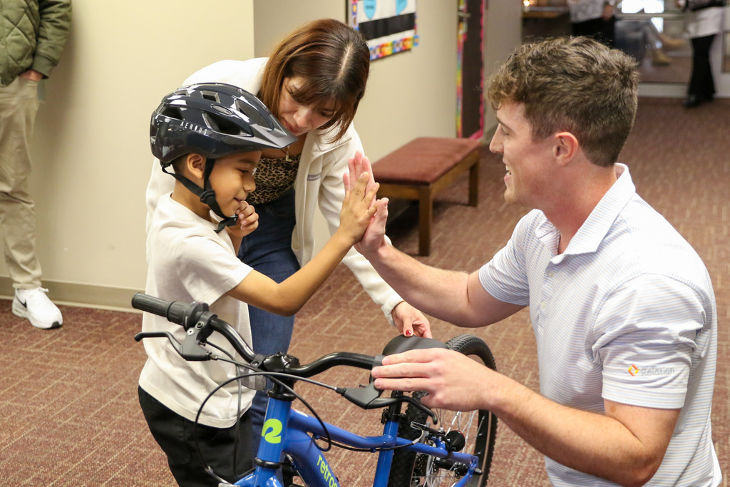 student high fiving a swerve member
