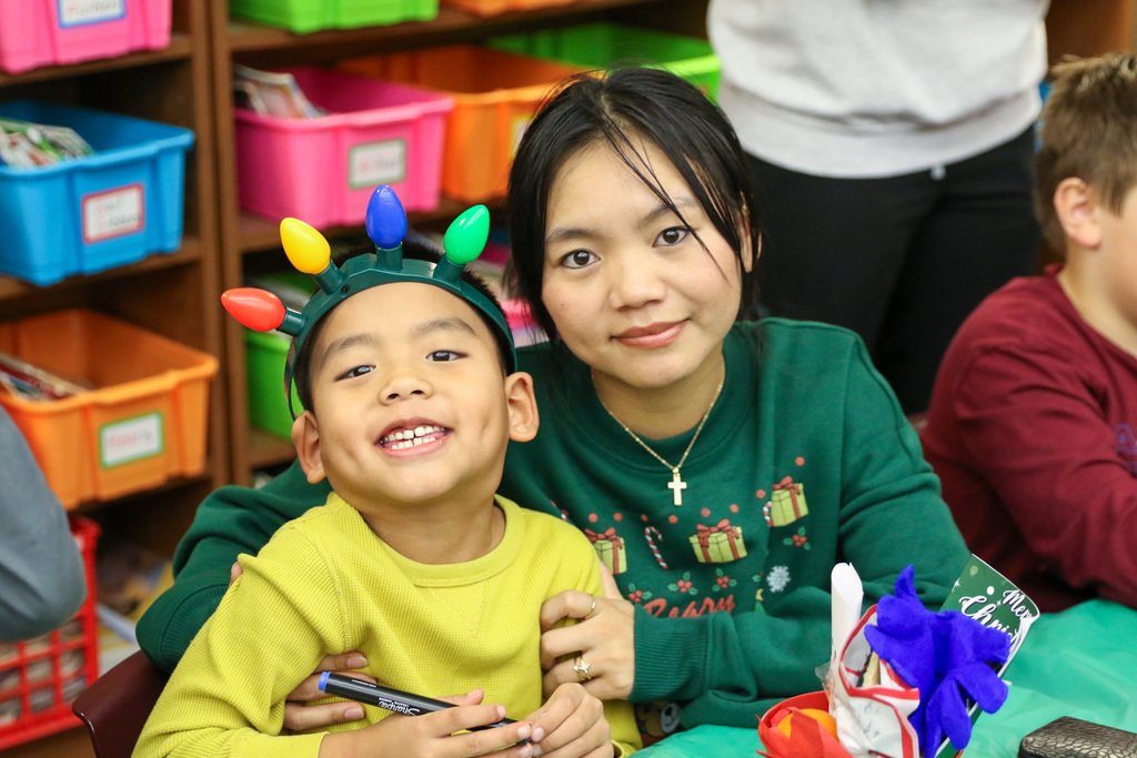 mom and son smile for a photo.
