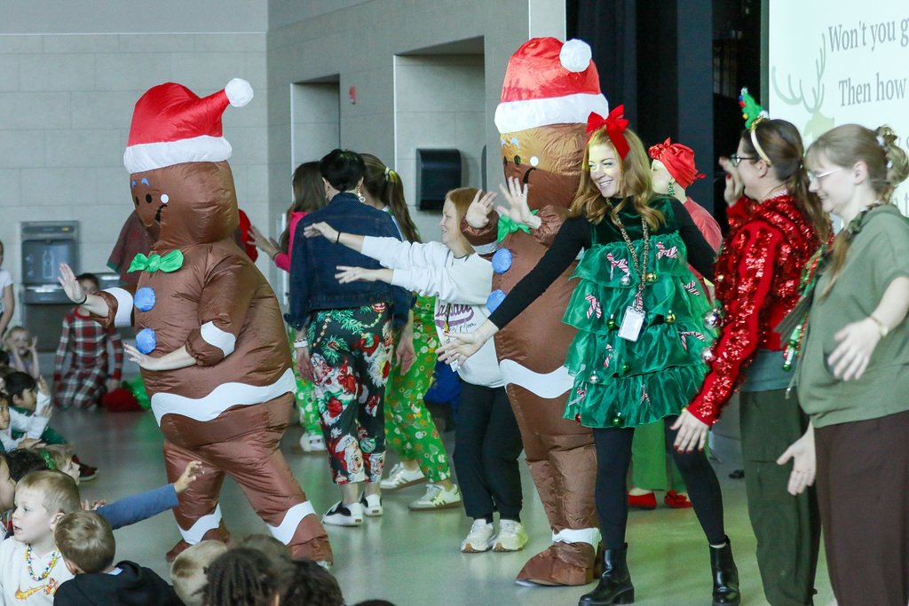 teachers and gingerbread men dancing