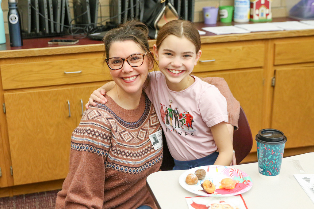 mom and daughter pose for a photo