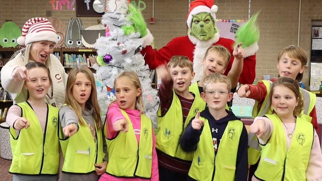 Grinch with students saying bye