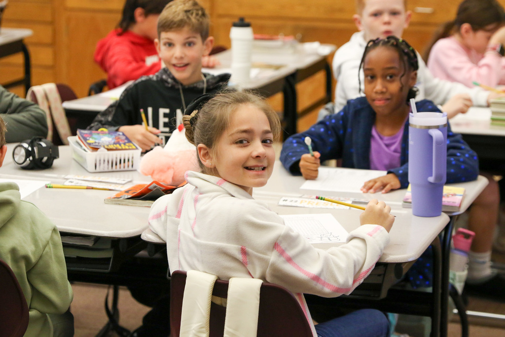 girl looking back smiling at the camera