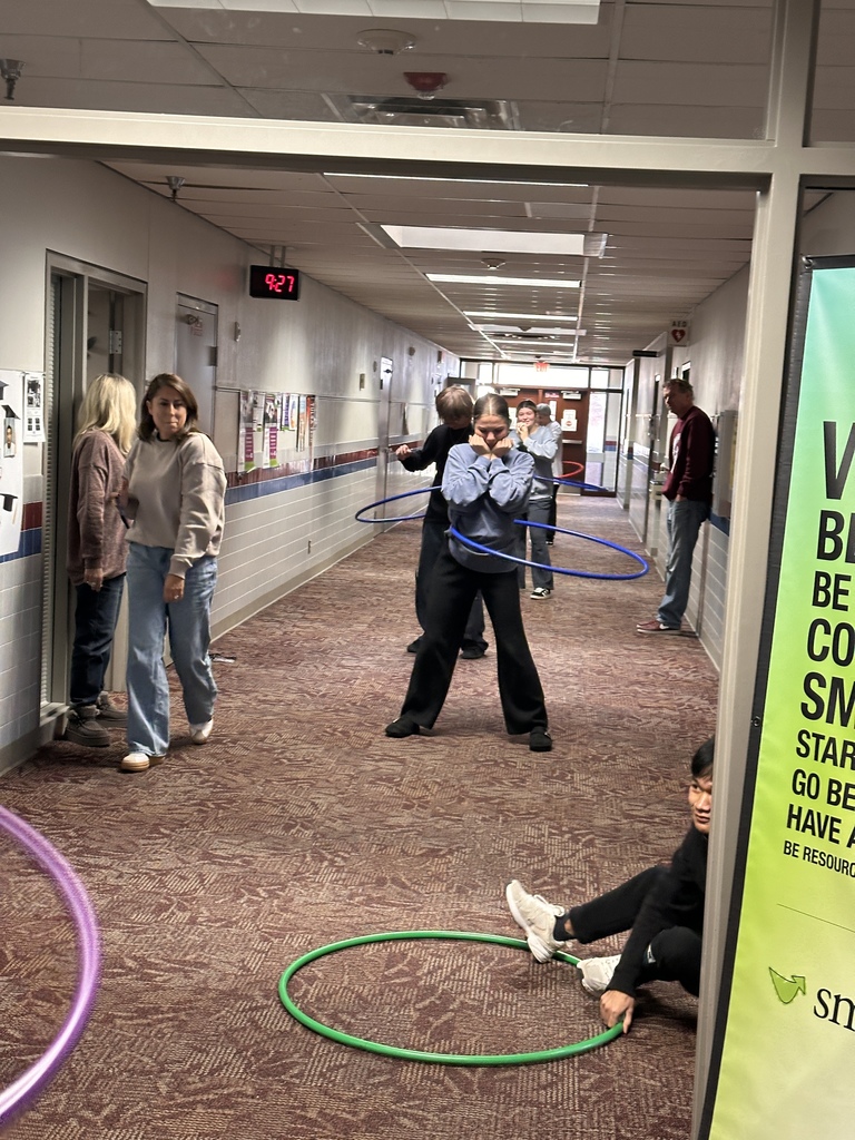 students hula hooping in the hallway 