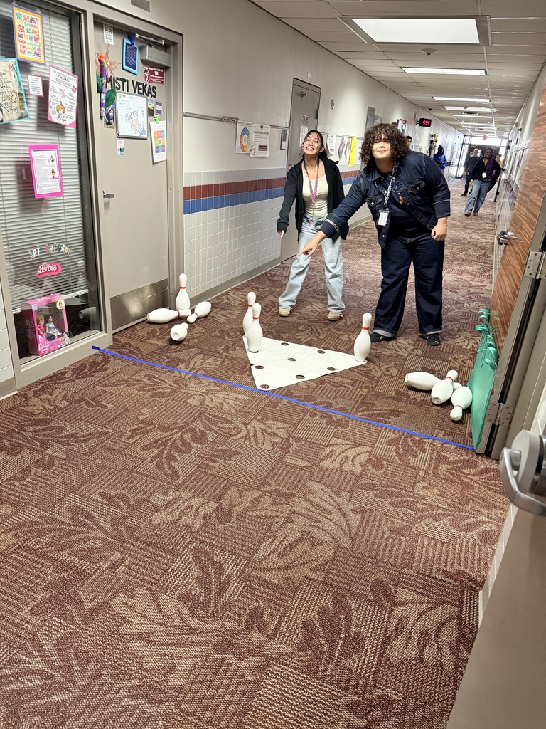 students at the end of the bowling lane