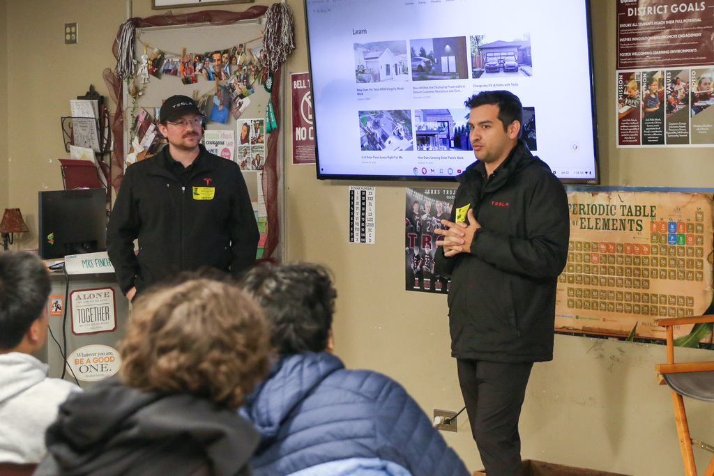 tesla reps teaching the class