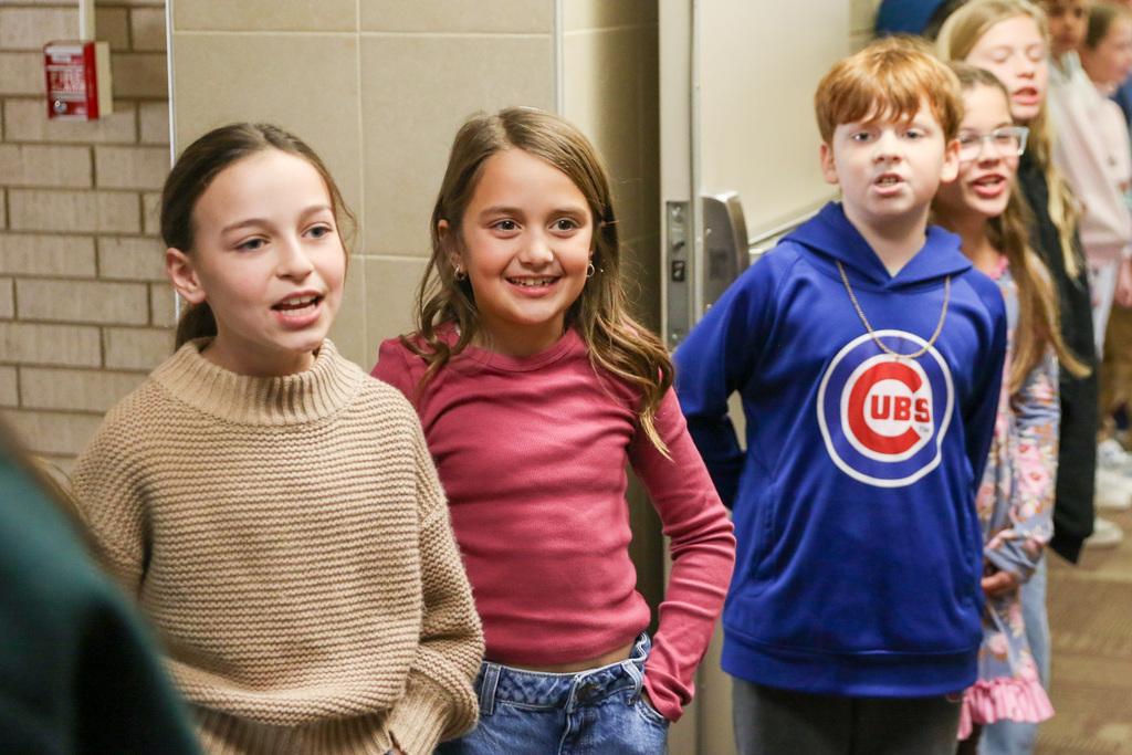 girls singing the state song