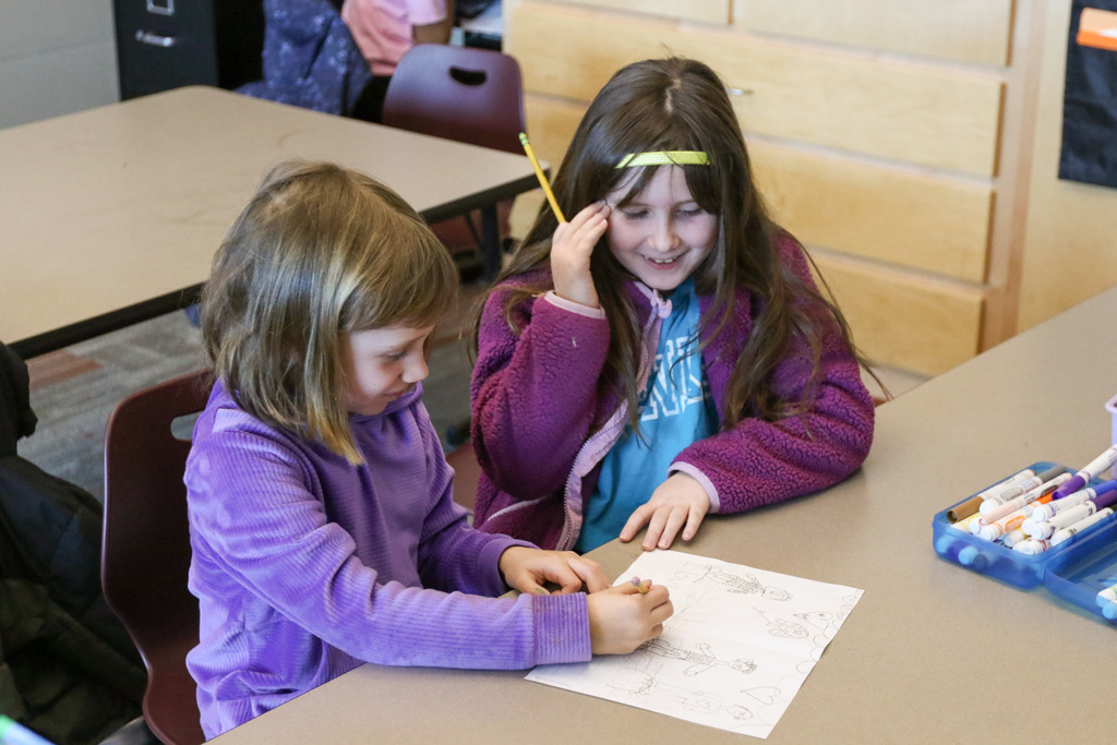 two girls drawing
