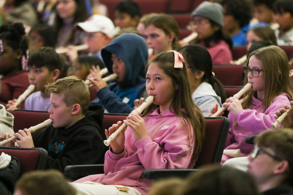 girl playing the recorder