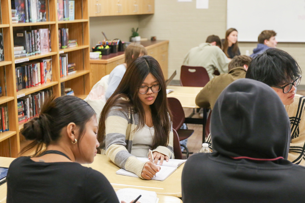 student taking notes
