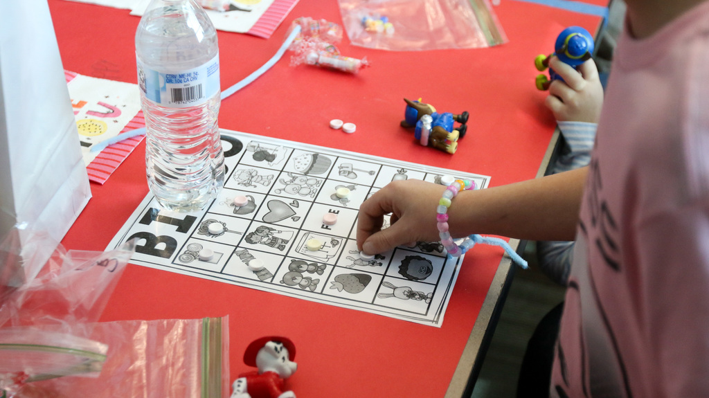 close up of a bingo board a boy is playing on