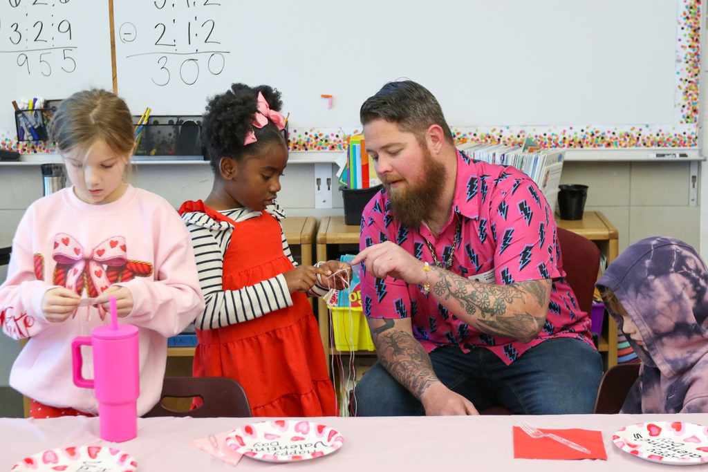 girl getting help from a dad