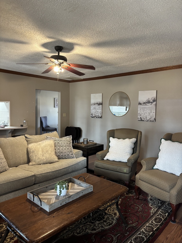 photo of living room of veterans home with new looking furniture assembled and arranged by Jenks High School students