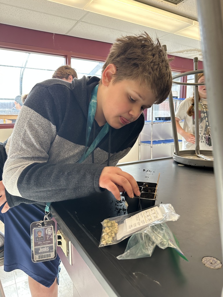 Student planting seeds