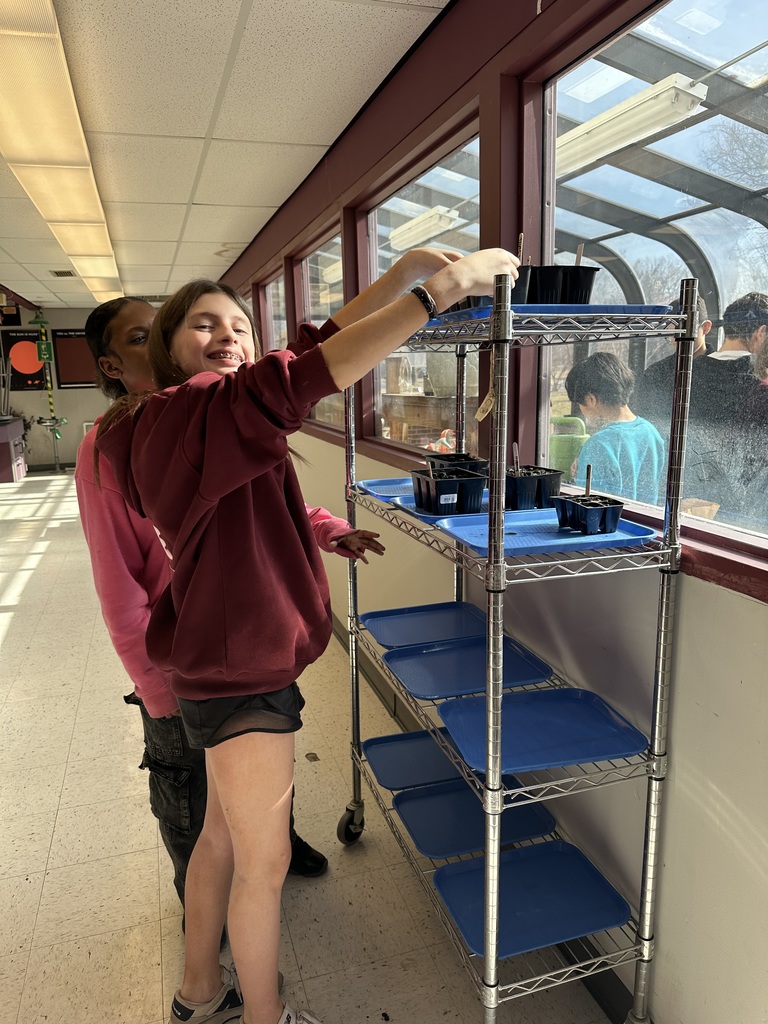 Student planting seeds