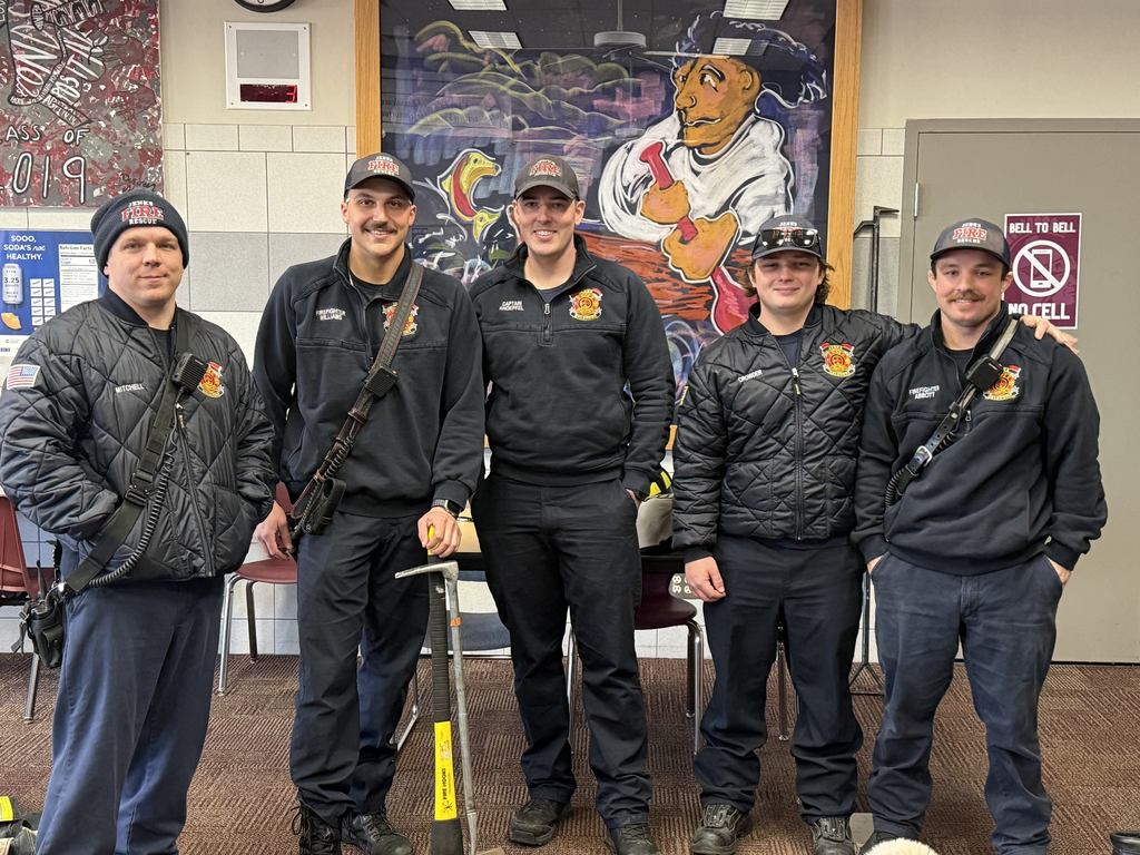 Five firefighters standing next to each other 