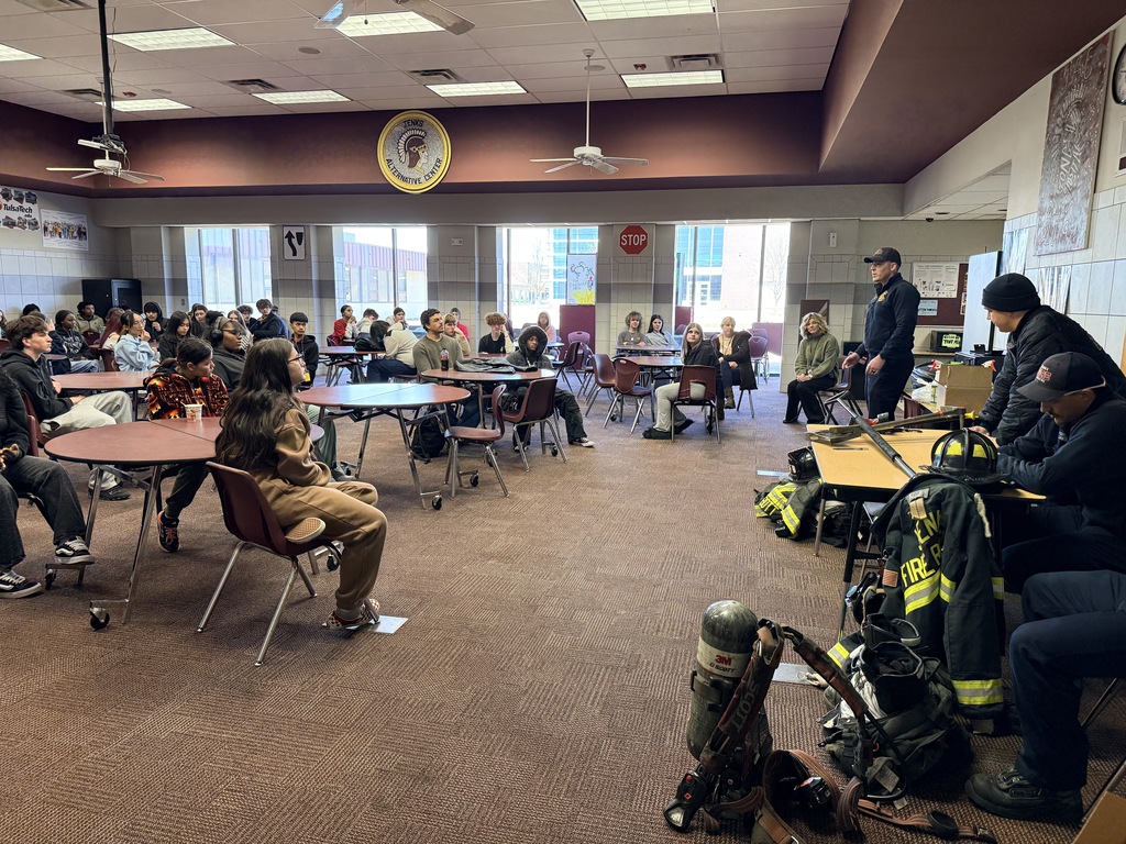 An image of the Commons where students are listening to a presentation by firefighters