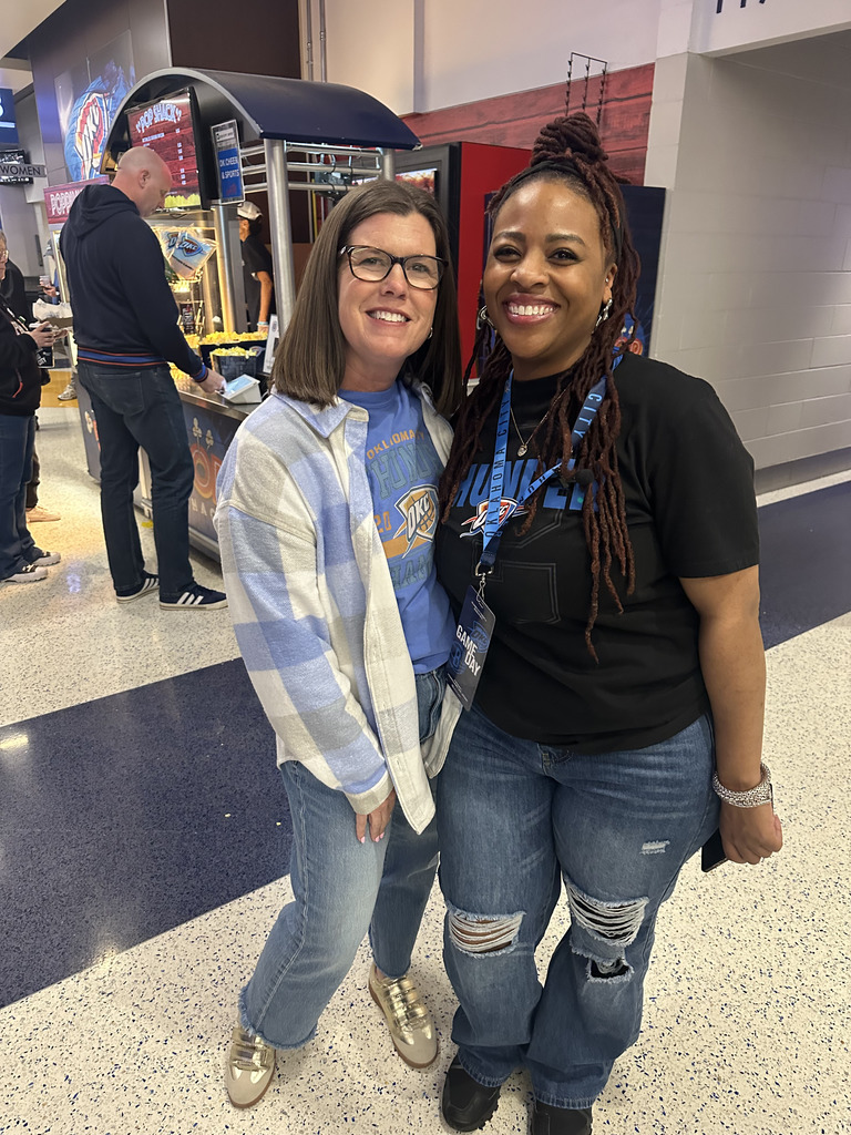Melodie Beacham, teacher of the game, and Shannon Davis ,school principal, at Thunder Basketball game
