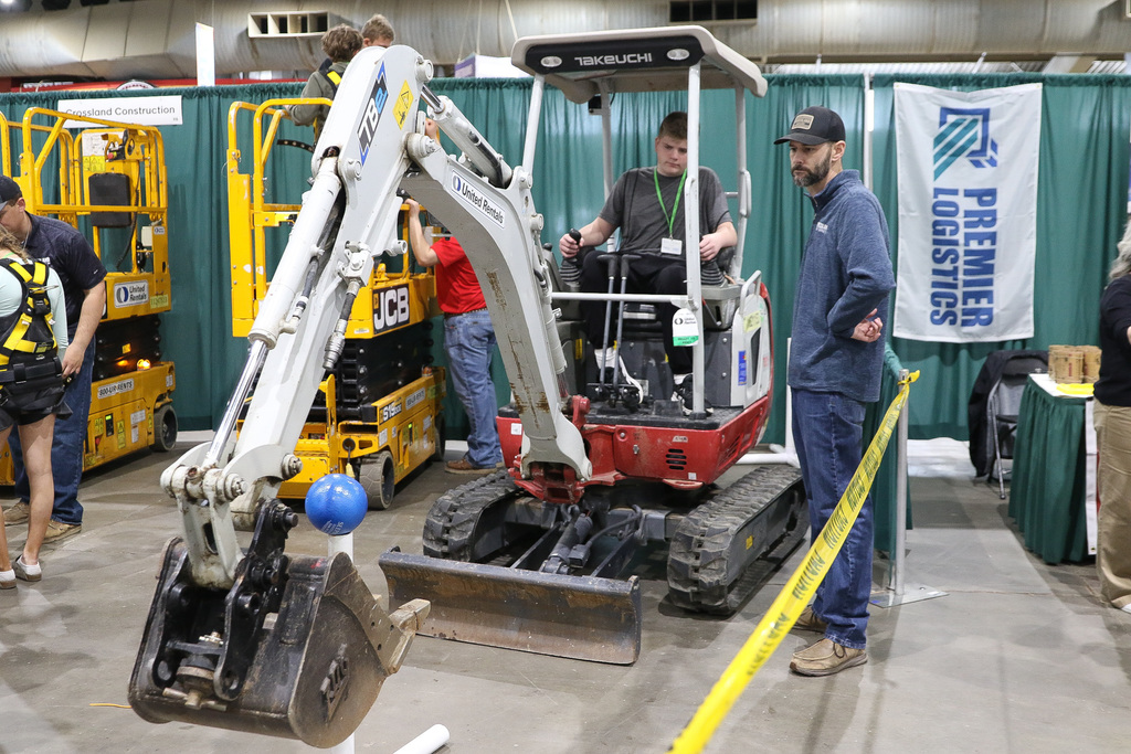 student in a mini dozer