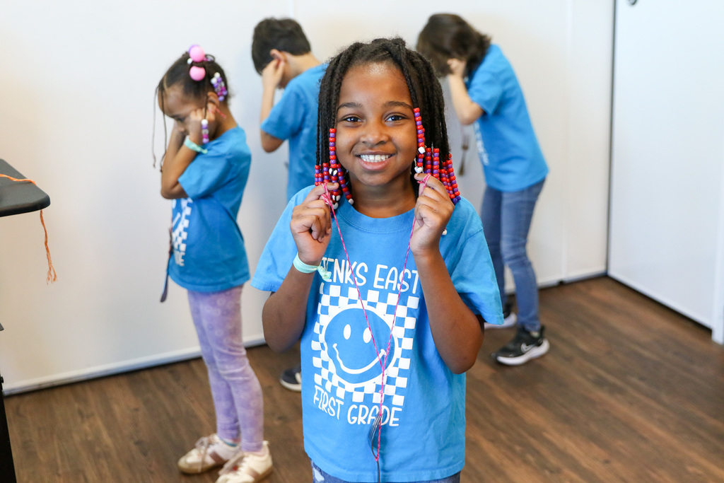 A string is tied to a fork and wrapped around the student's fingers. When the student hits a surface the fork, they can hear the sounds from the string to their ears!