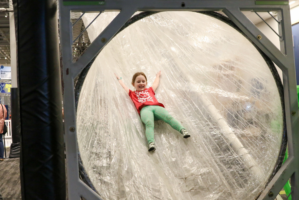 girl sliding down a tape slide