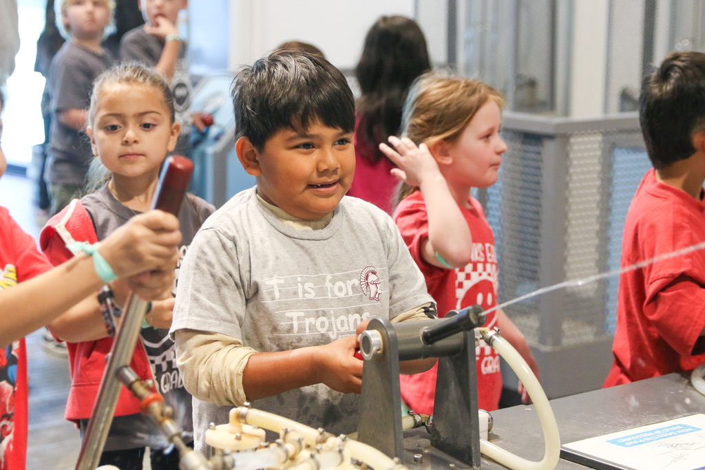 student using a water sprayer