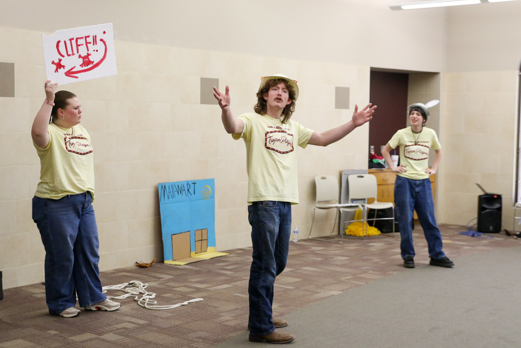 Three high schoolers performing "Stories From and Elementary Classroom" to Jenks Southeast students.
