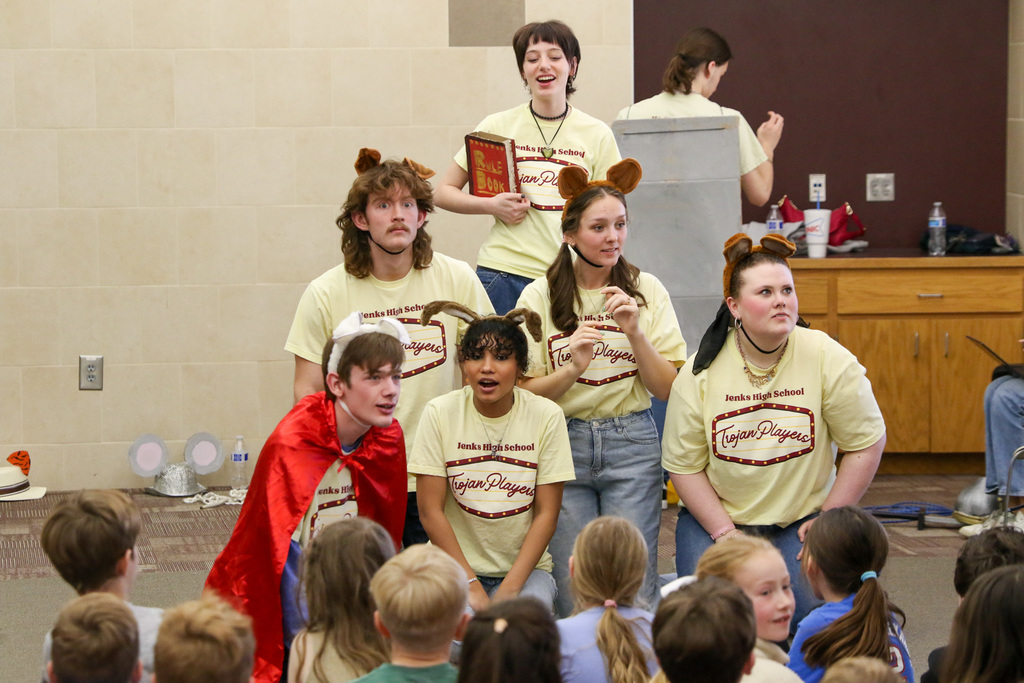 Four high schoolers performing "Stories From and Elementary Classroom" to Jenks Southeast students.