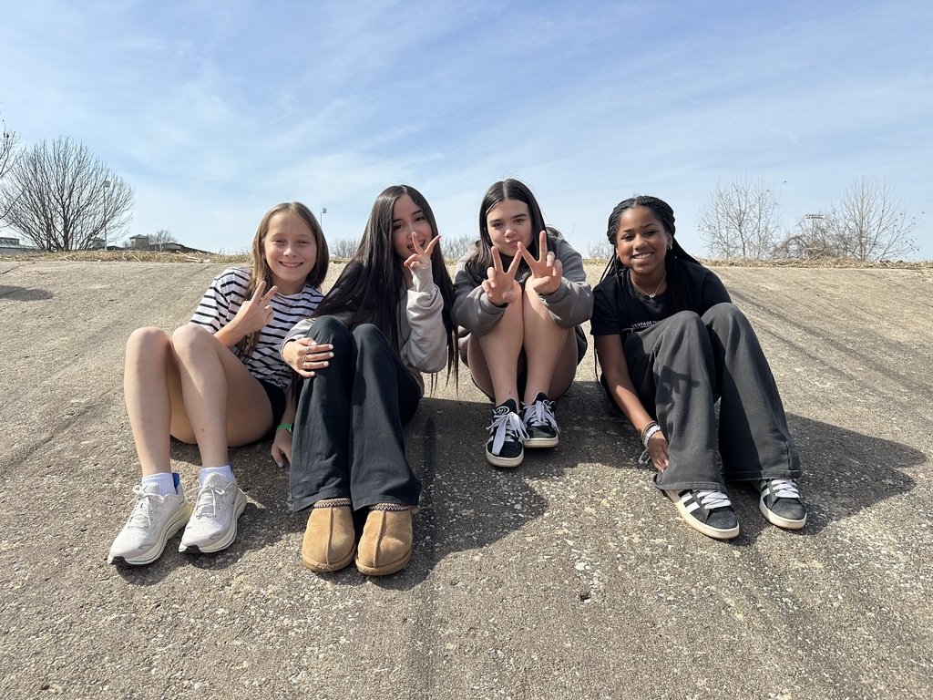 4 girls on drainage ditch