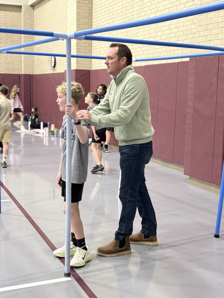 Student and family during Specials with Someone Special (in pe).