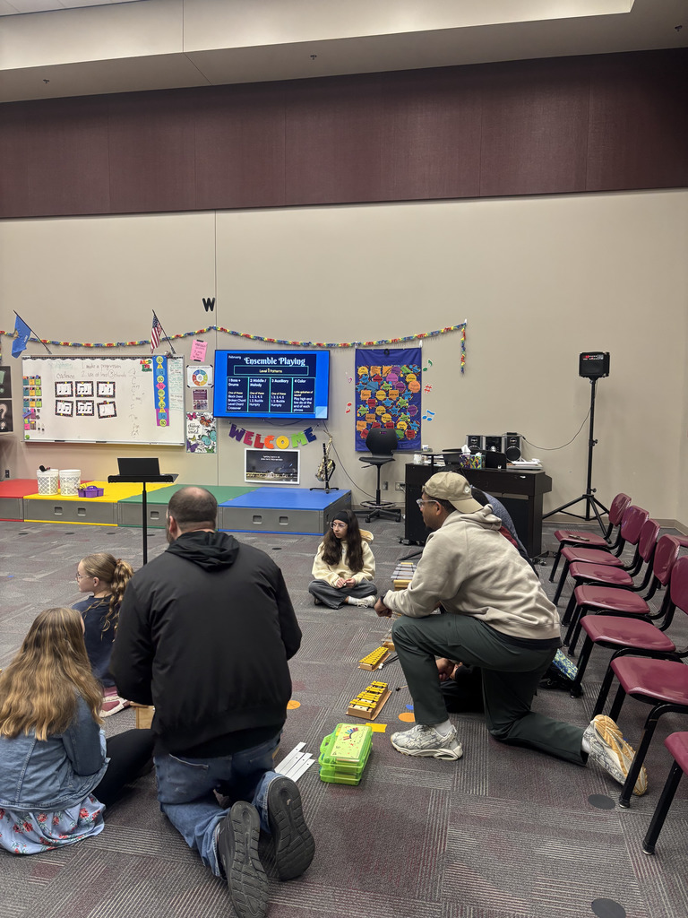 Student and family during Specials with Someone Special (in music).